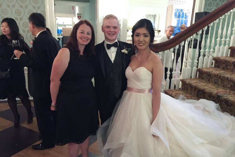 Newlywed couple and their officiant