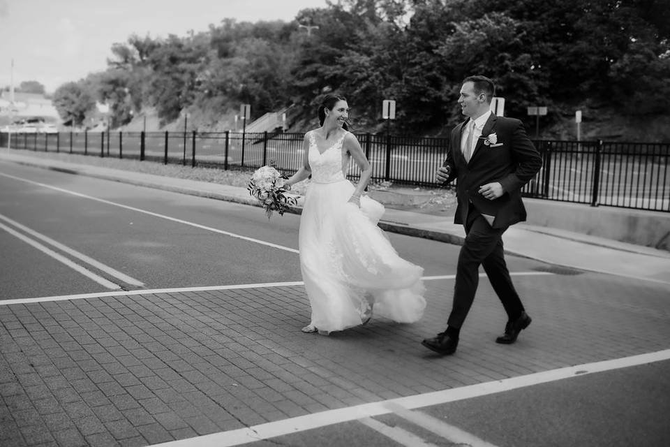 Newlyweds crossing the street