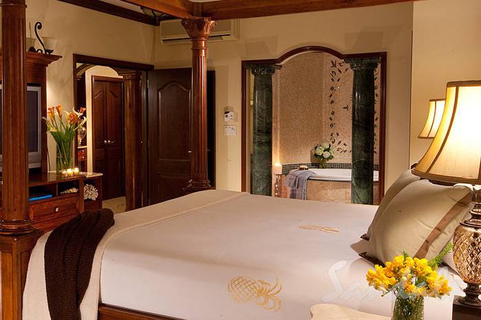 Beautifully appointed bedroom at Sandals Resorts