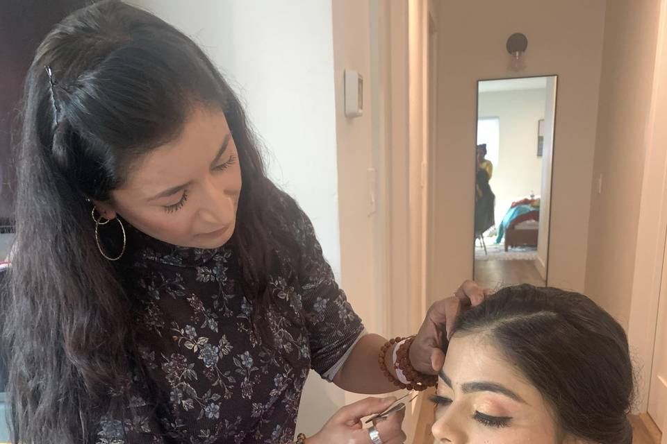 Dimpsi applying bridal makeup