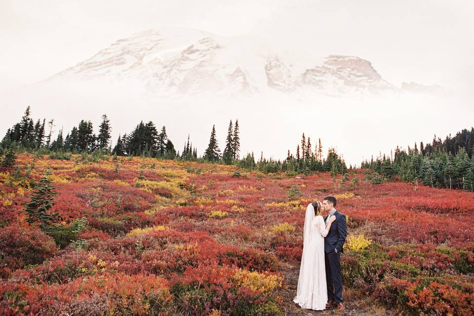 Couple kissing - Rustic Chic Mt. Rainier Wedding