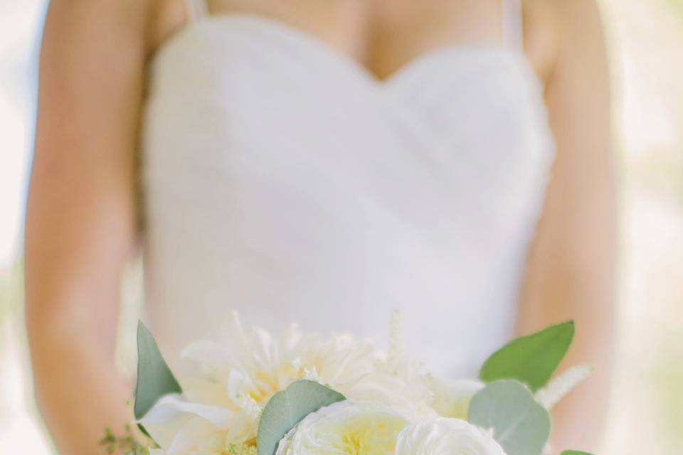 Classic White bouquet of garden roses, ranunculus and dahlias.