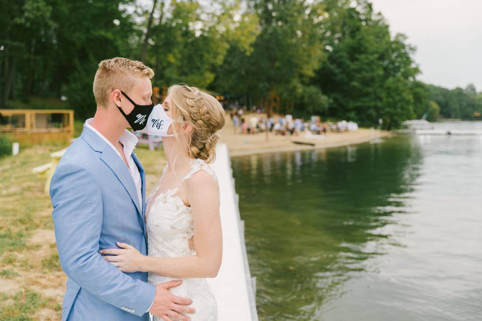 Wedding kiss with masks
