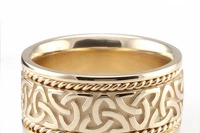 This lovely Knot design Celtic wedding band is 10mm wide and has two small braids on each side of the center part. This wedding band is also available in 11, 12mm. The band is high polished.