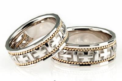 A masterpiece among religious wedding bands, this 8mm Two-tone Handmade wedding ring is a besteller for good reason! With the cross designs and small braids at each side, this band is a favorite of lovers of religious styles. This ring is high polished.