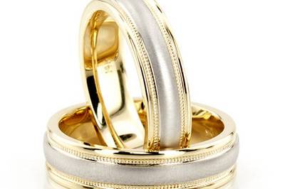 An excellent choice for the lovers of simple elegance, this 5mm wide Two-tone wedding ring set has milgrain edges. Also available in all-white and all-yellow gold. Center of the band is brush finished. Each side is high polished.
