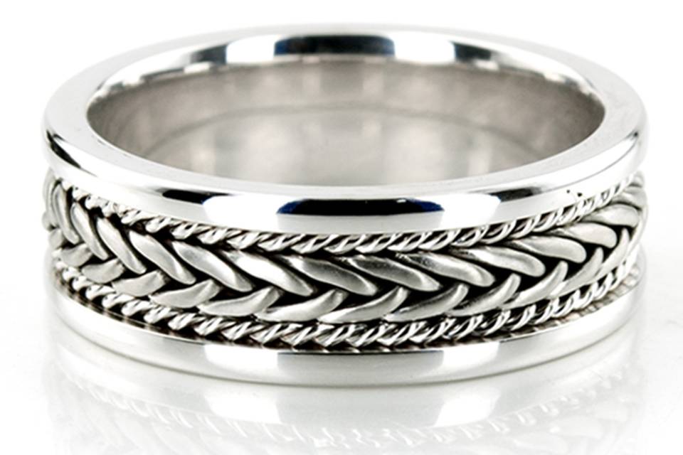 A true showcase of handcrafted perfection, this 7mm wide Handmade wedding ring combines classic and contemporary elements. Center braid of the band is satin finish, small braids and sides are high polished.