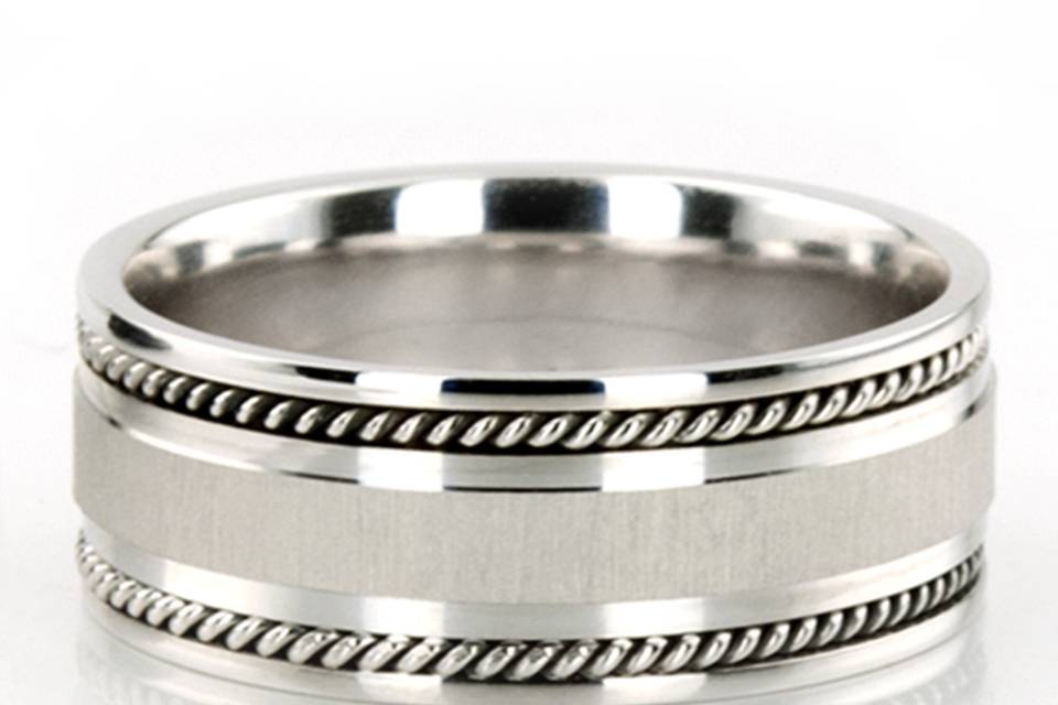 Thanks to its sturdy design and 8.5mm width, this Hand crafted wedding ring is a favorite Men's jewelry. Center of the band is brush finished, small braids and each side are high polished.