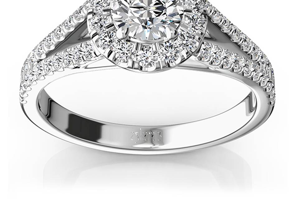 ENR9371An eye catcher, this micro pave set split shank halo engagement ring set with 0.73 ct. tw. dazzling diamonds. Your choice of center stone will be source of light in this setting, reminding her one of the most memorable times of her life. This ring is available in 14k, 18k, platinum and palladium.