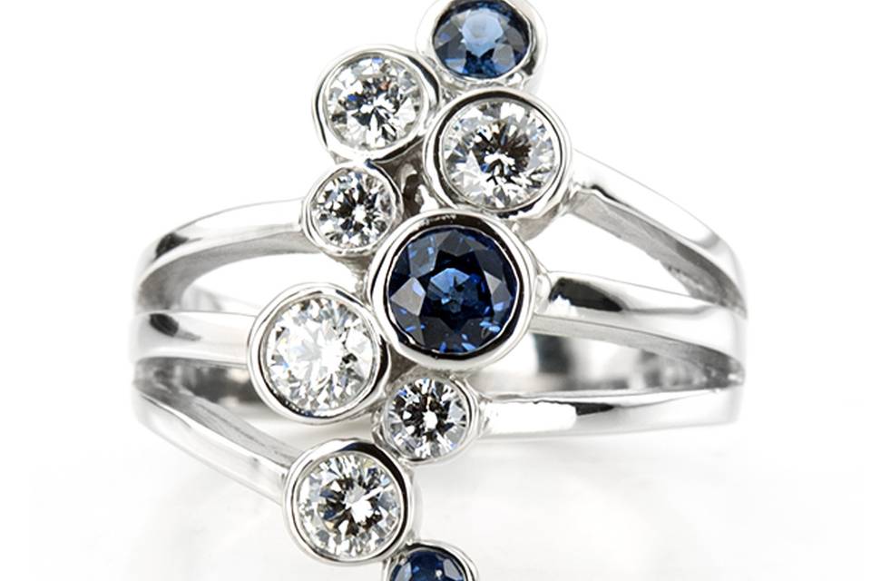 FWB8765Beautiful combination of diamonds and sapphires displayed in this anniversary band. This ring not only a wedding band but also a fashion statement. Tis bubble ring furnished with 0.75ct diamonds and 0.50ct tw. AAA sapphires.