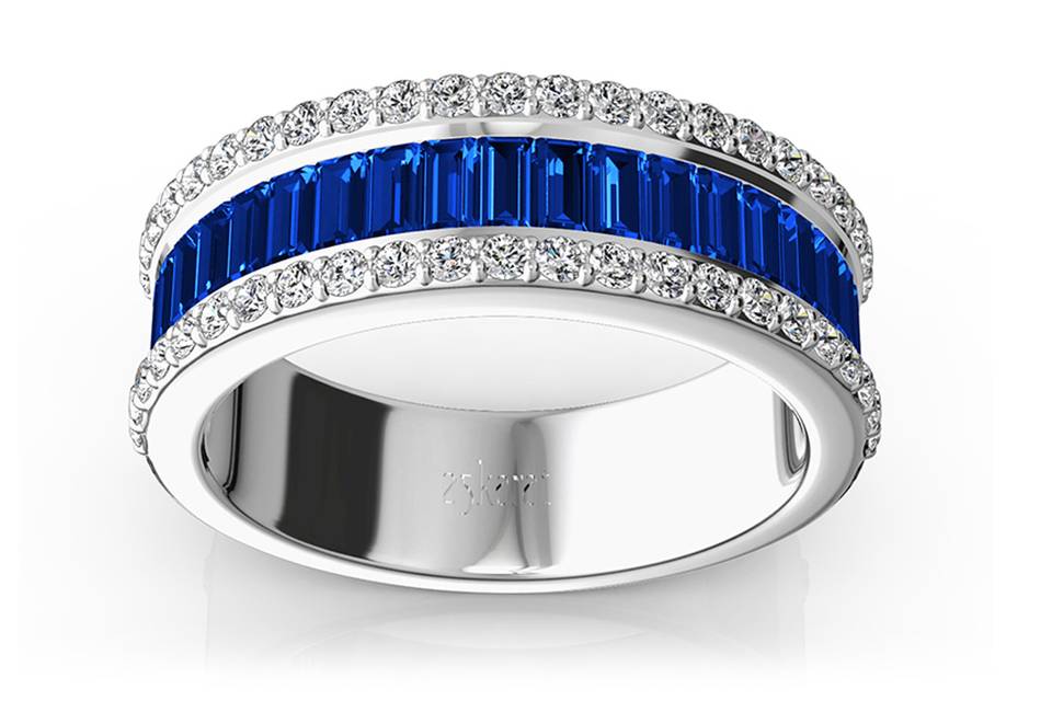 WB9302Faceted baguette cut sapphires are accented with round brilliant diamonds. This solid anniversary ring is furnished with 21 pieces 3x1.5mm straight baguette blue sapphires and GH-SI round diamonds. This gorgeous wedding band is available in 14k, 18k, platinum and palladium.