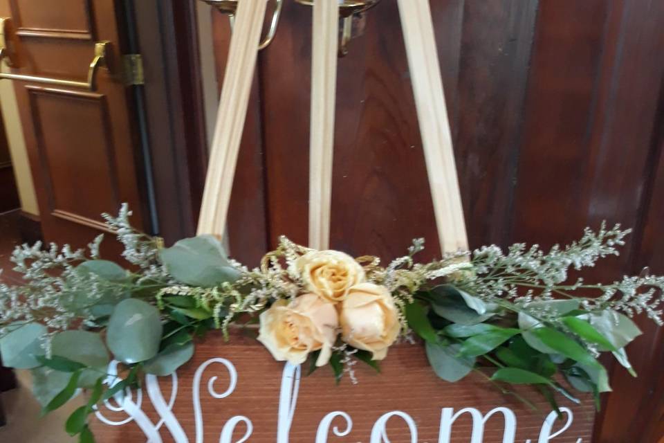 Sign with fresh flowers