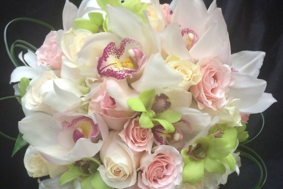 CLUTCH BOUQUET- WHITE CYMBIDIUMS, GREEN DENDROBIUM, LIGHT PINK & WHITE ROSES