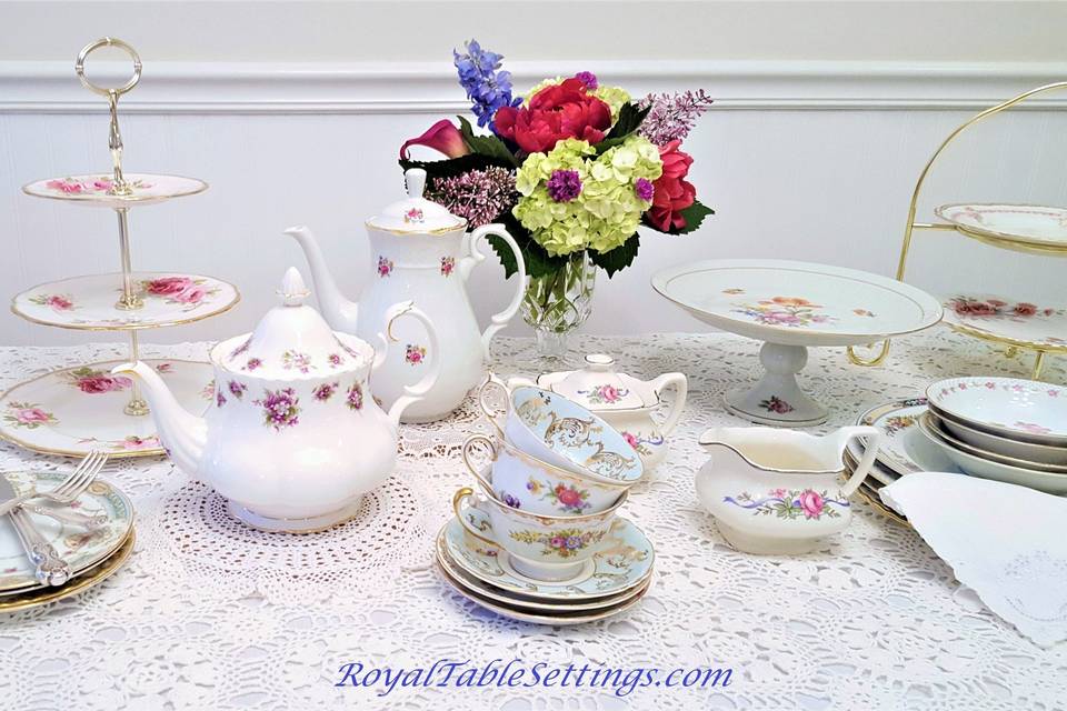 Three tiered cake stands, sugar and creamer bowls, and crystal vases complete any vintage look for your event.