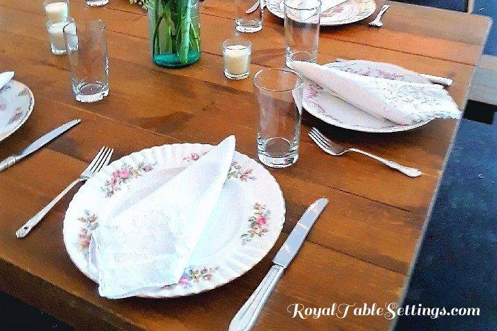 Wow your guests with a beautiful vintage table setting for your birthday, shower, wedding or corporate event. Wildflowers mixed with roses and daisies accented the mismatched china plates. Silver-plated silverware, napkins and candles instantly transport your guests to the country, where having dinner with family and friends is a time to celebrate! Contact us today and we can help recreate this beautiful vintage setting for your next event.