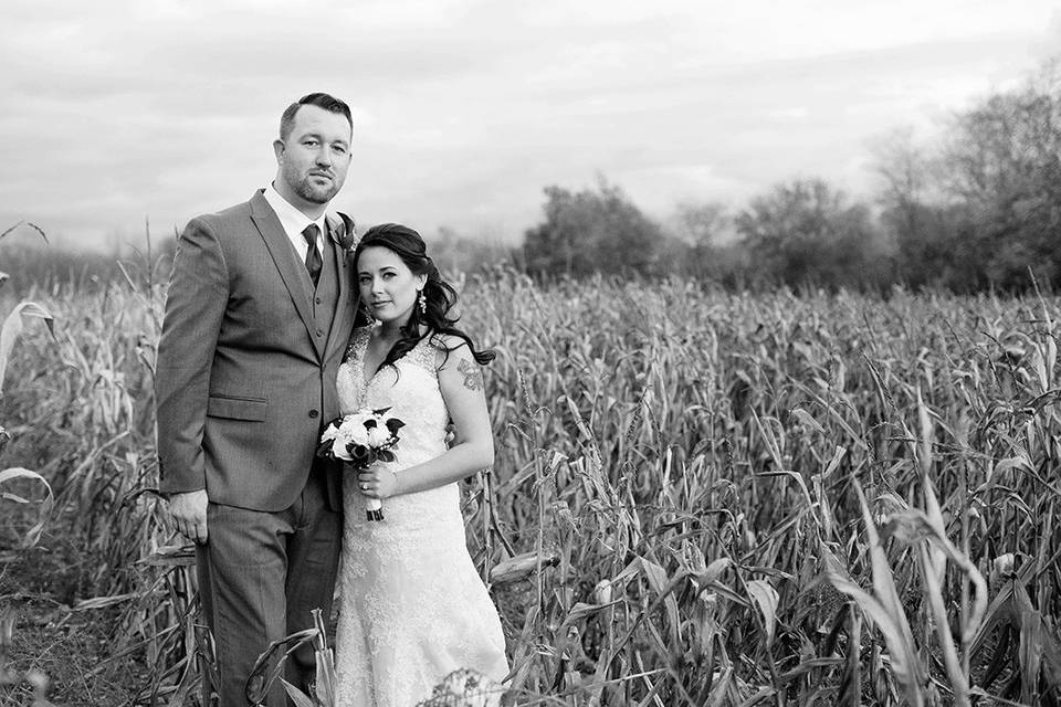 Couple in field - Mischief and Laughs Photography