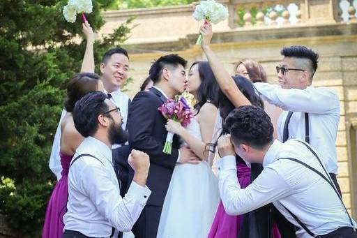 The couple with the bridesmaids and groomsmen