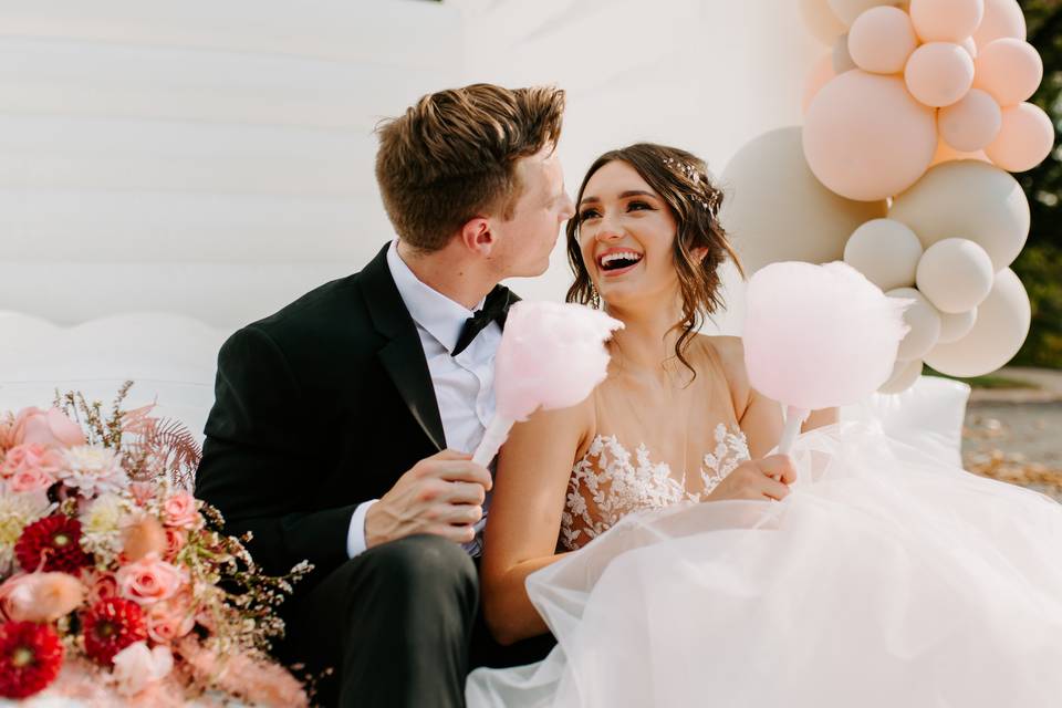 Newlyweds with balloons and florals