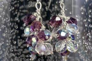 Dainty earrings feature a cluster of amethyst and clear faceted crystal. This style is available in a variety of crystal colors and combinations of small and large crystals.