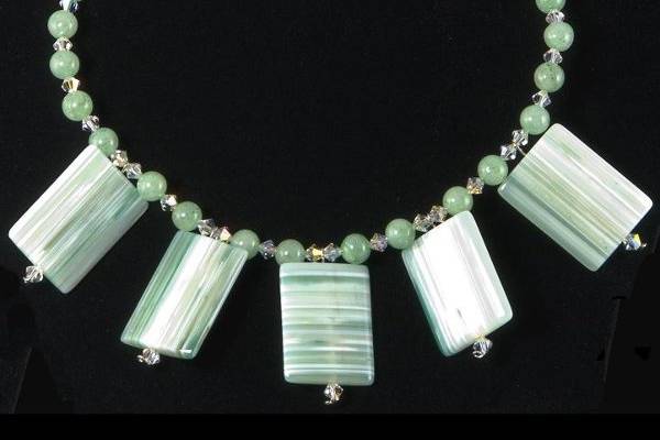 Necklace of aventurine and dramatic squares of striped agate, accented with Swarovski crystals.