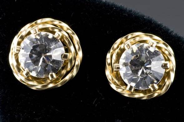 Dramatic stud earrings of faceted cubic zirconia wrapped in a halo of twisted golden wire.  This style is available in silver of gold-fill in a variety of cubic zirconia colors.