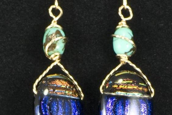 Breath-taking earrings feature a designer dichroic glass scarab with turquoise and various gemstone beads on gold or silver wires.