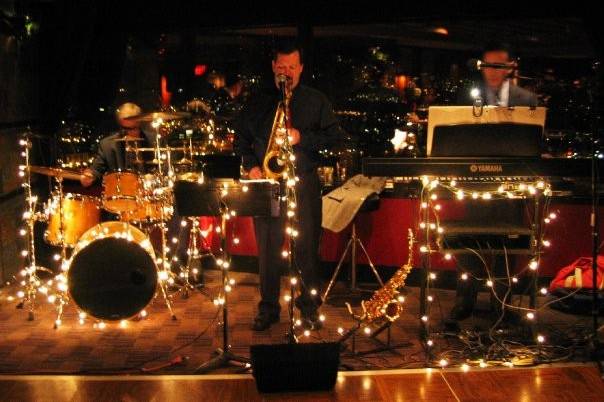 UpFront quintet performing at company Christmas party in the Portland City Grill in downtown Portland, OR.