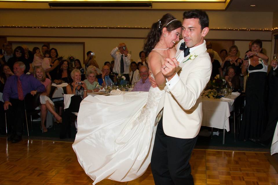Happy wedding couple doing their first dance during their reception our band performed at.