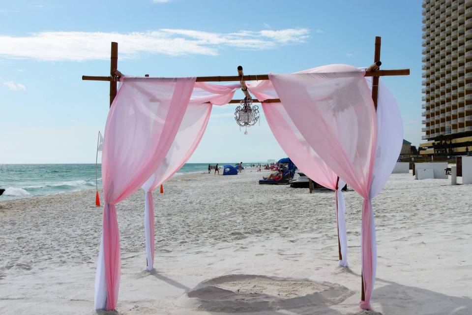 Eight pole arch, with Chandelier and heart included  with your  wedding colors.