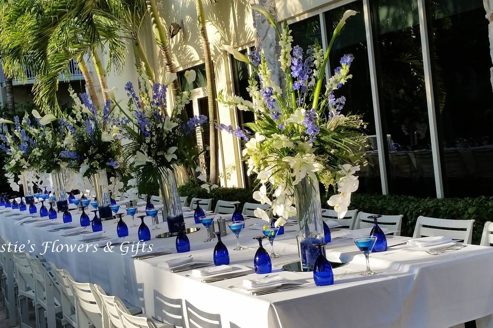 Blue glassware and floral centerpieces