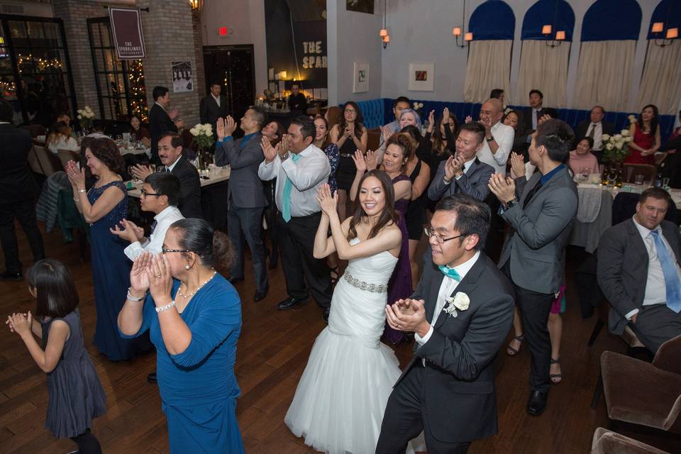 Couple and guests dancing