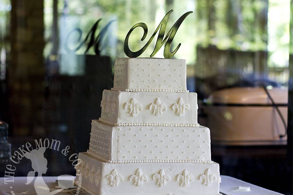 Elegant, all-white fleur de lis square wedding cake