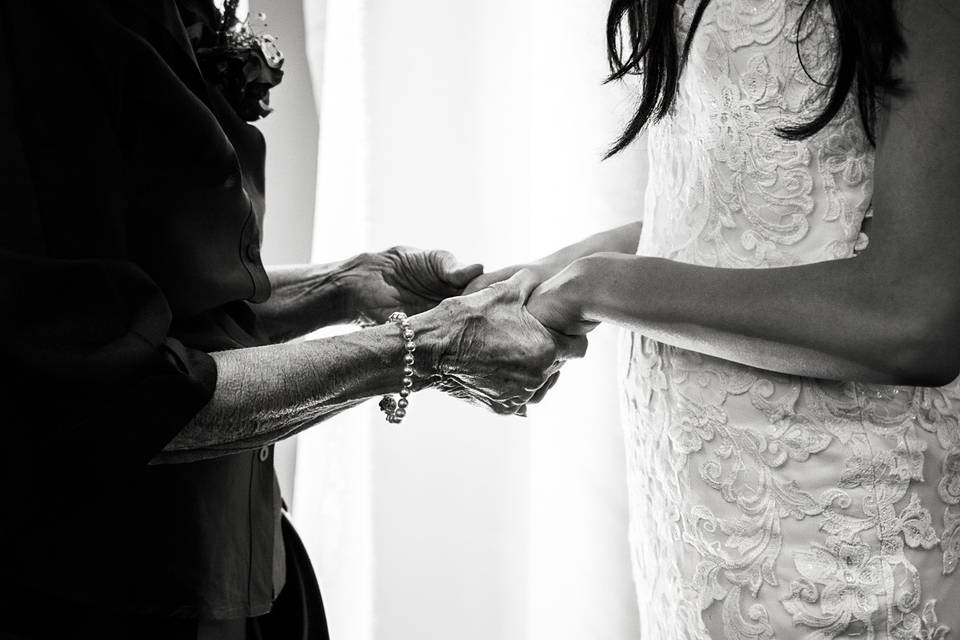 Hands of bride and grandmother