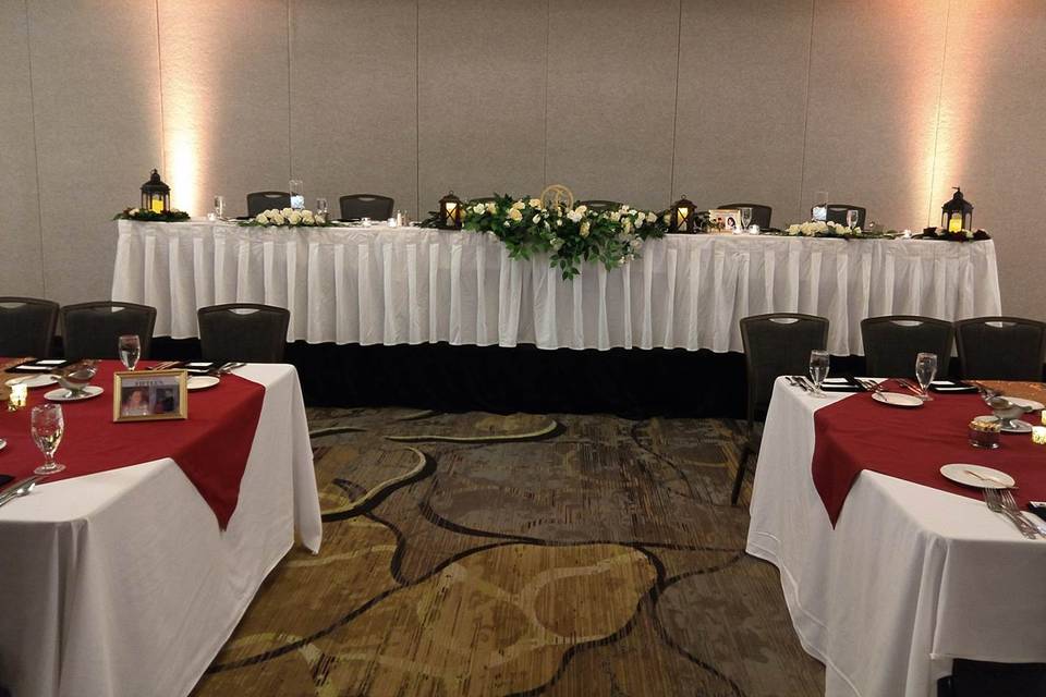 A large head table on risers.