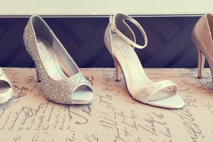 We carry many types of shoes for our brides as well as in the colors they love! Our satin shoes can be dyed to match your wedding colors.