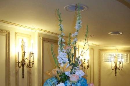 Centerpiece, now set in place on the guest table at the Palmer House Hilton.  Each arrangement was set on a glass tower, which was then surrounded at the base with fresh Hydrangea and votive candles.