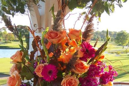 An oversized vase of fall-tone flowers set inside the gazebo at Palos Country Club for a gorgeous October wedding.