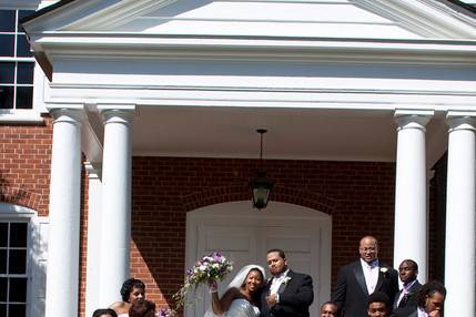 The couple with their groomsmen and bridesmaids,