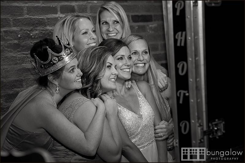 A bride and her maids having a blast in the Grins and Giggles photo boothPhoto by Bungalow Photography