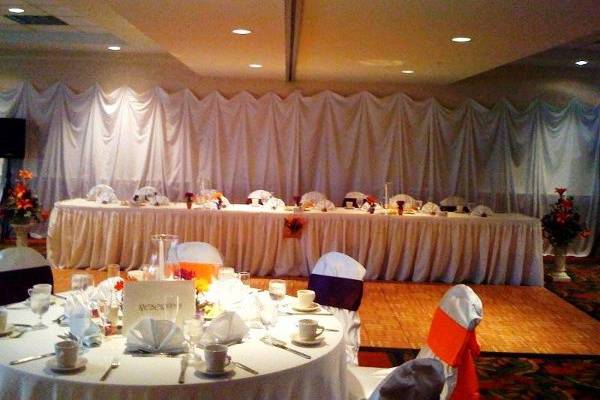 We can have multiple set ups for any event. This one being a head table with the dance floor in front.