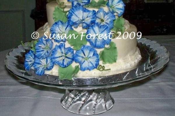 A Mini Three Tier Traditional Buttercream Cake with Dainty Tea Roses and String-work