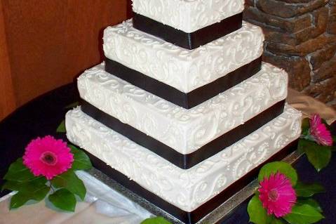 Hand-piped buttercream palm trees accent this tropical waterfall cake