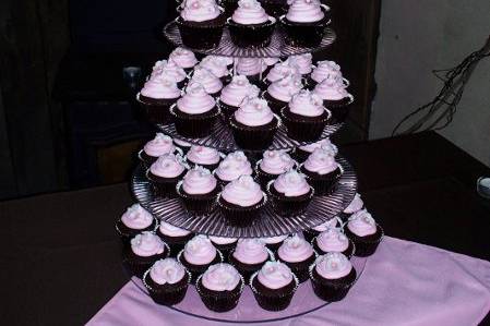 Apple Blossom Cupcake Wedding!  Chocolate cupcakes, chocolate colored foil liners, pink buttercream swirl, accented with homemade fondant apple blossoms and edible pearls!  Dainty and sweet!