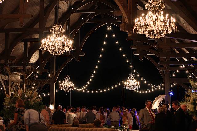 Our gorgeous Signature Chandeliers with festoons of G50 bulb string lighting for Dale Earnhardt Jr.'s  wedding to Amy Reiman at Childress Vineyards in Lexington, North Carolina