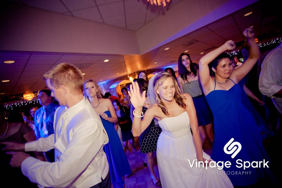 Couple dancing with guests