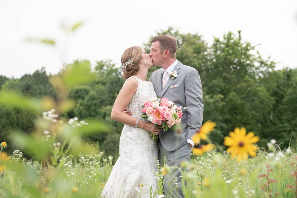 Flower field bride and groom