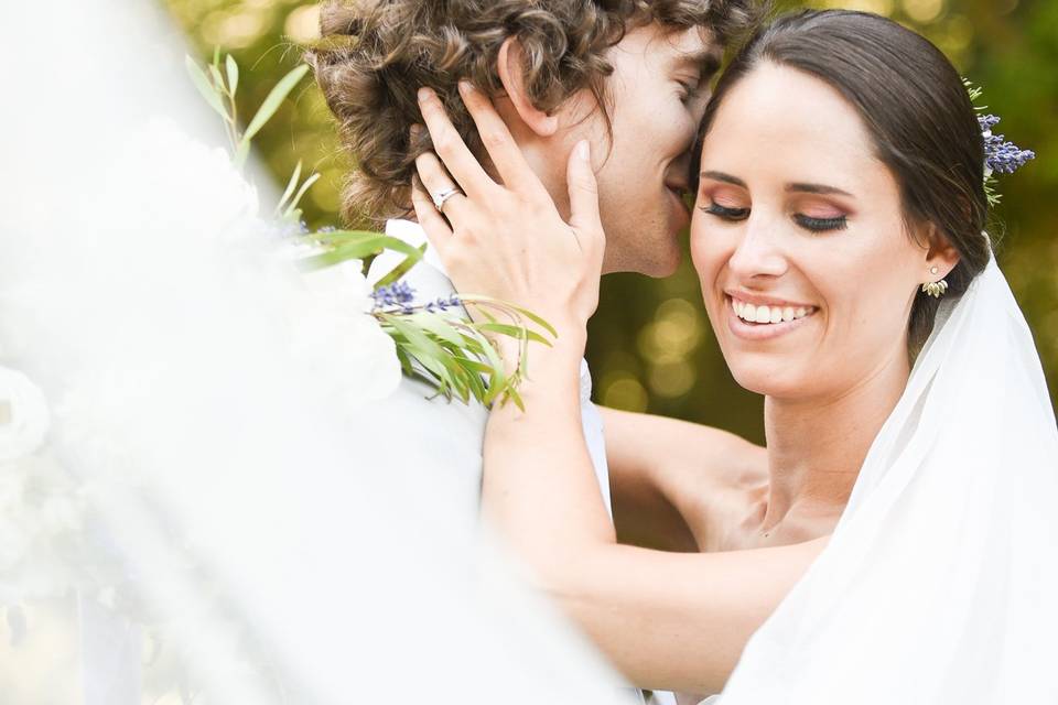 Bride and groom portrait veil