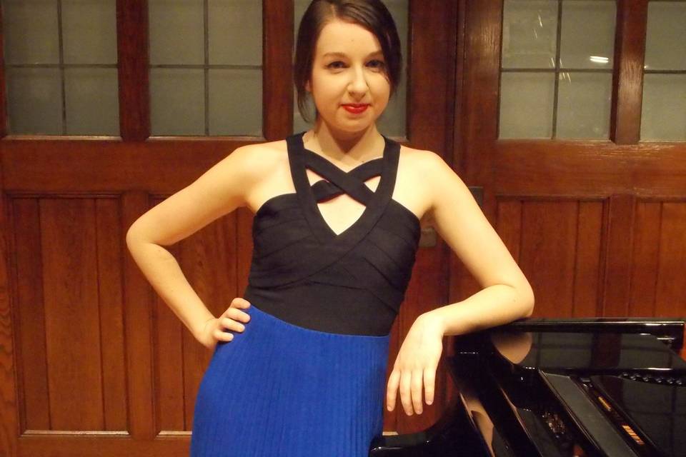 Posing beside the piano