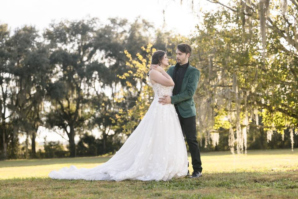 Newlyweds outside near trees