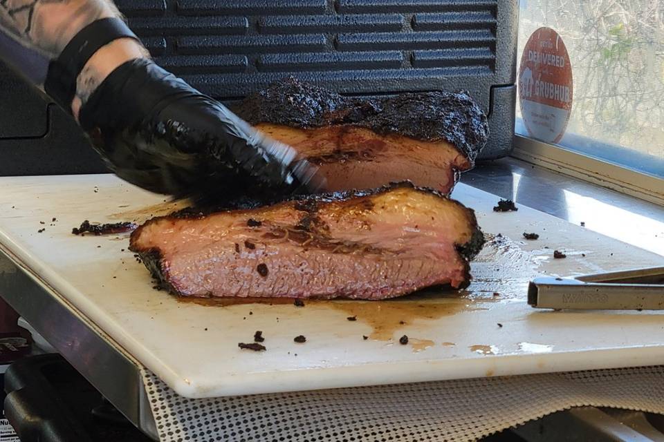 Juicy brisket getting sliced